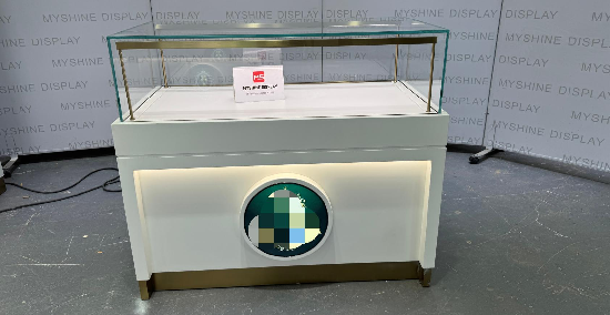 White & Gold Jewelry Display Counter with Circular Brand Accent