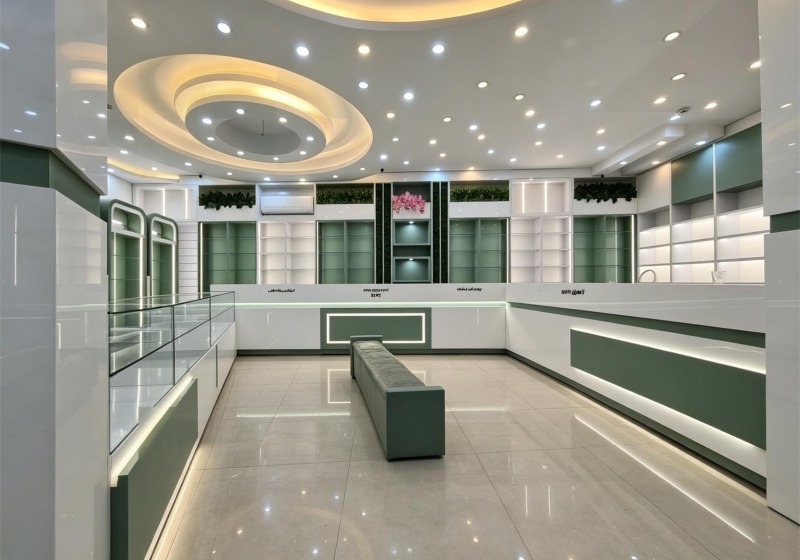 Modern Light Luxury Jewelry Store with Curved Showcase & Sleek White-Green Tones