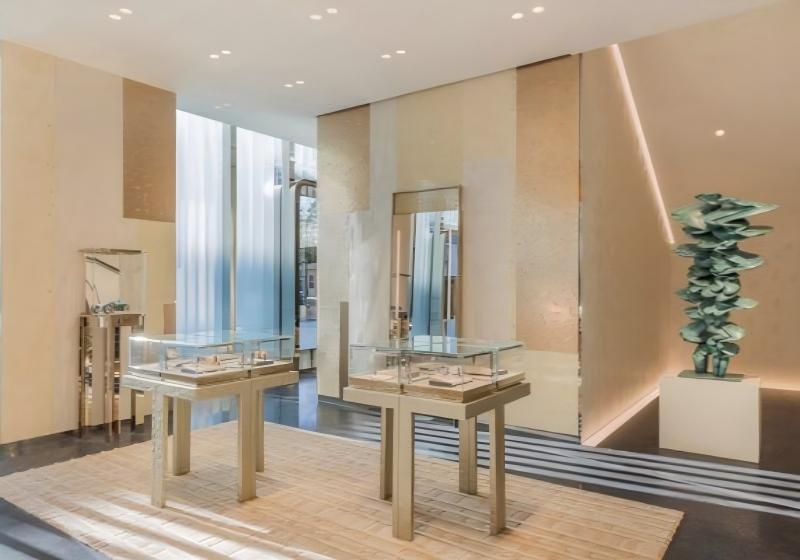 Couture-Inspired Jewelry Boutique Display System: Textured White Cabinets, Gilded Accents, and Pedestal Cases for a Luxury Retail Experience